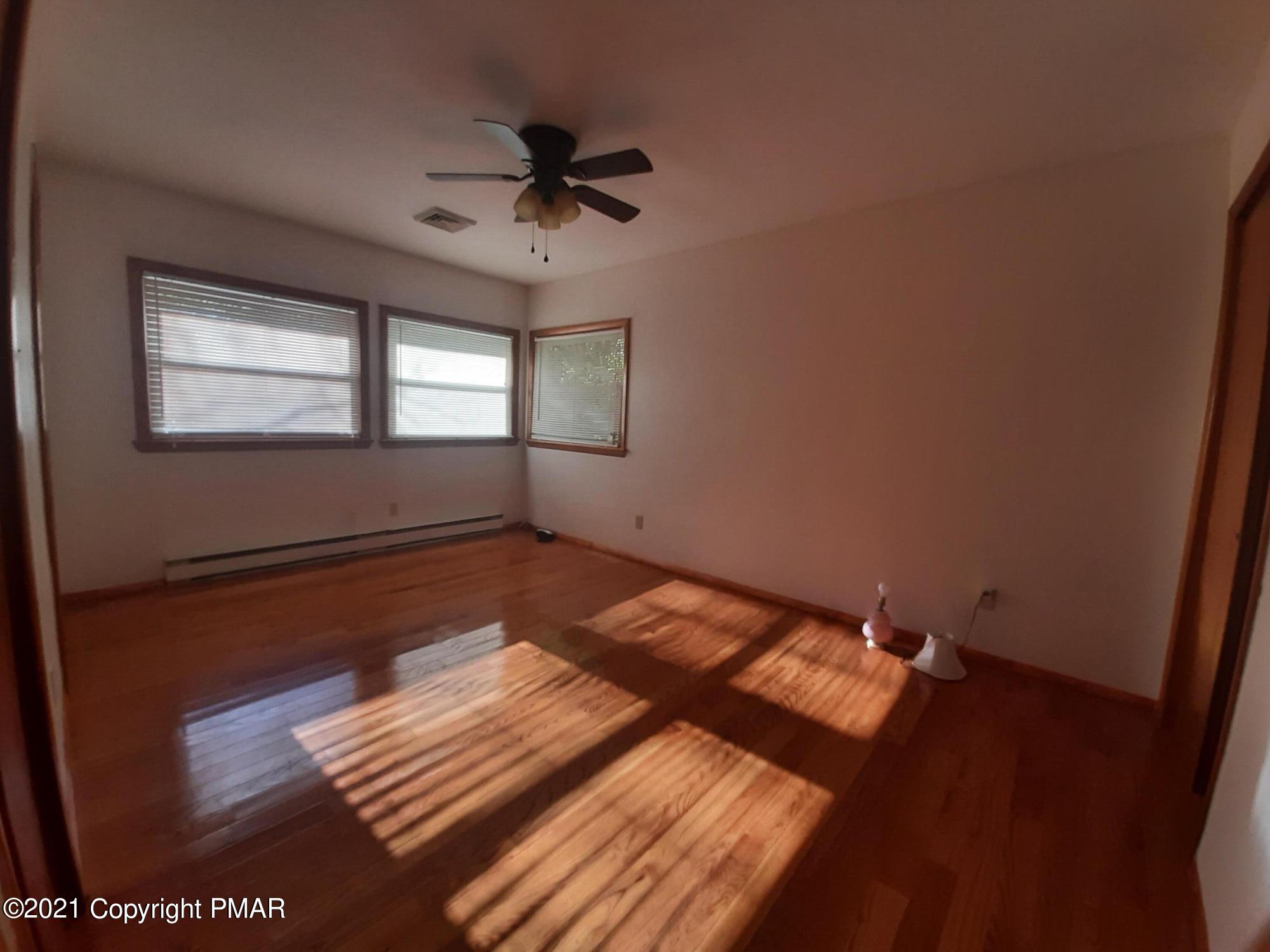 235 Dyson Road Swiftwater, PA 18370 - Photo 20 of 36 a view of a room with wooden floor and window