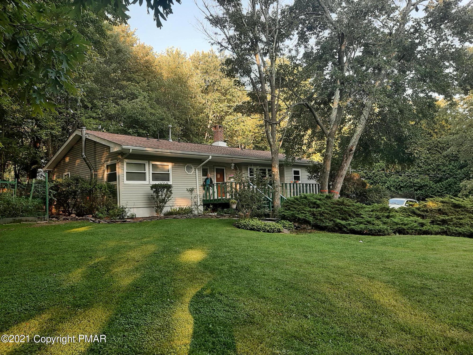 235 Dyson Road Swiftwater, PA 18370 - Photo 2 of 36 a front view of house with yard and green space
