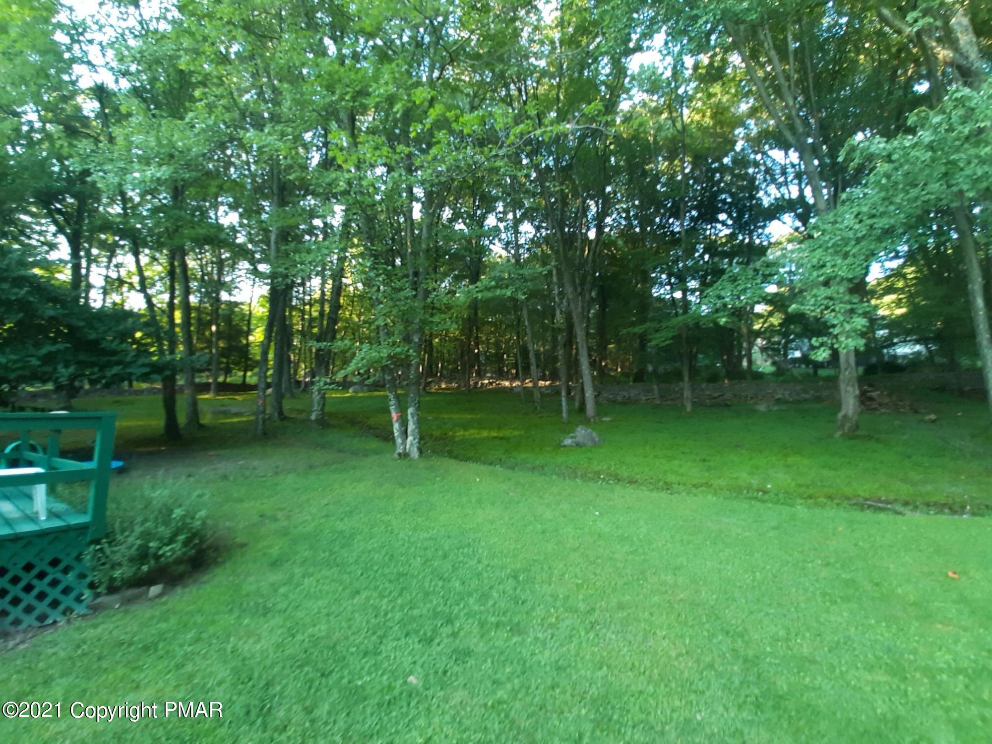 235 Dyson Road Swiftwater, PA 18370 - Photo 29 of 36 a backyard of a house with lots of green space