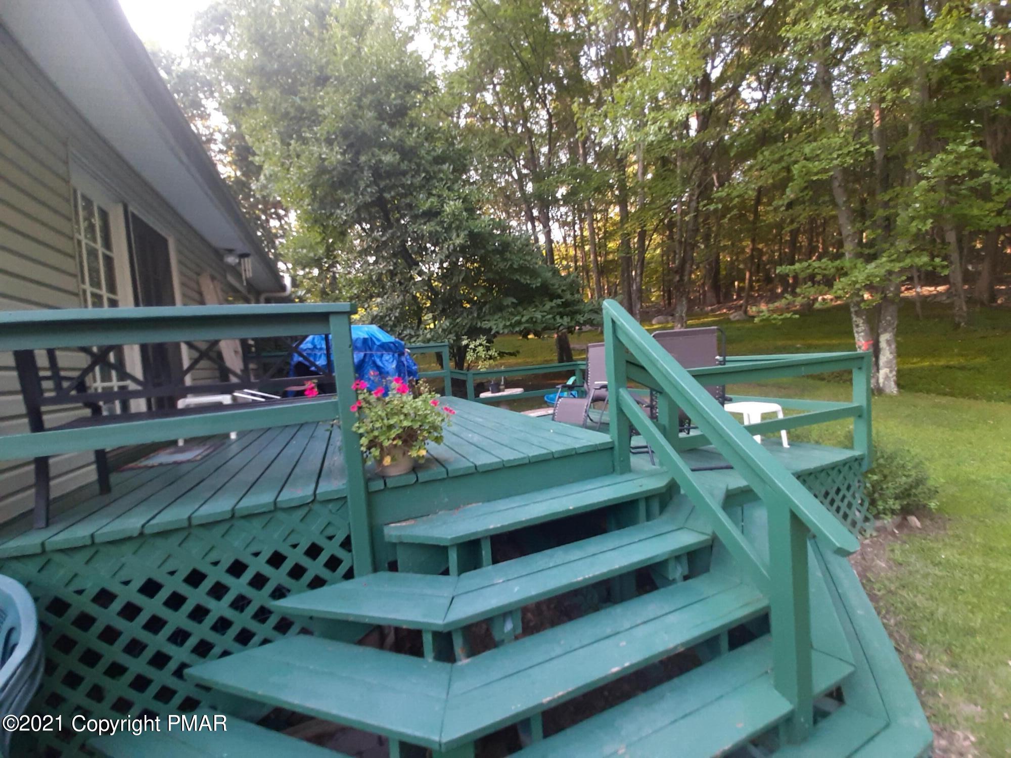 235 Dyson Road Swiftwater, PA 18370 - Photo 4 of 36 a view of a chairs setting in the backyard of a house