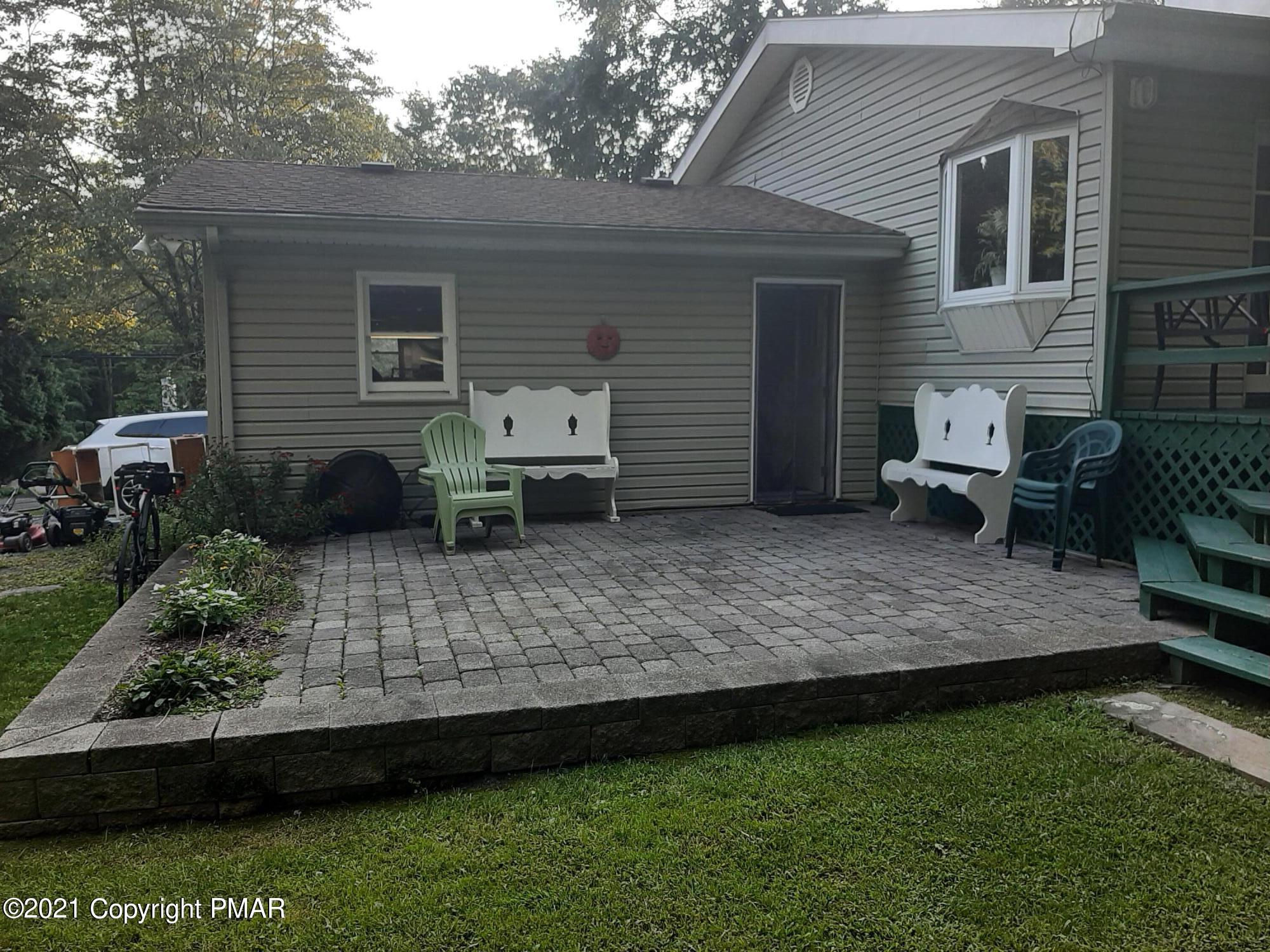 235 Dyson Road Swiftwater, PA 18370 - Photo 5 of 36 a view of a backyard with chair and table