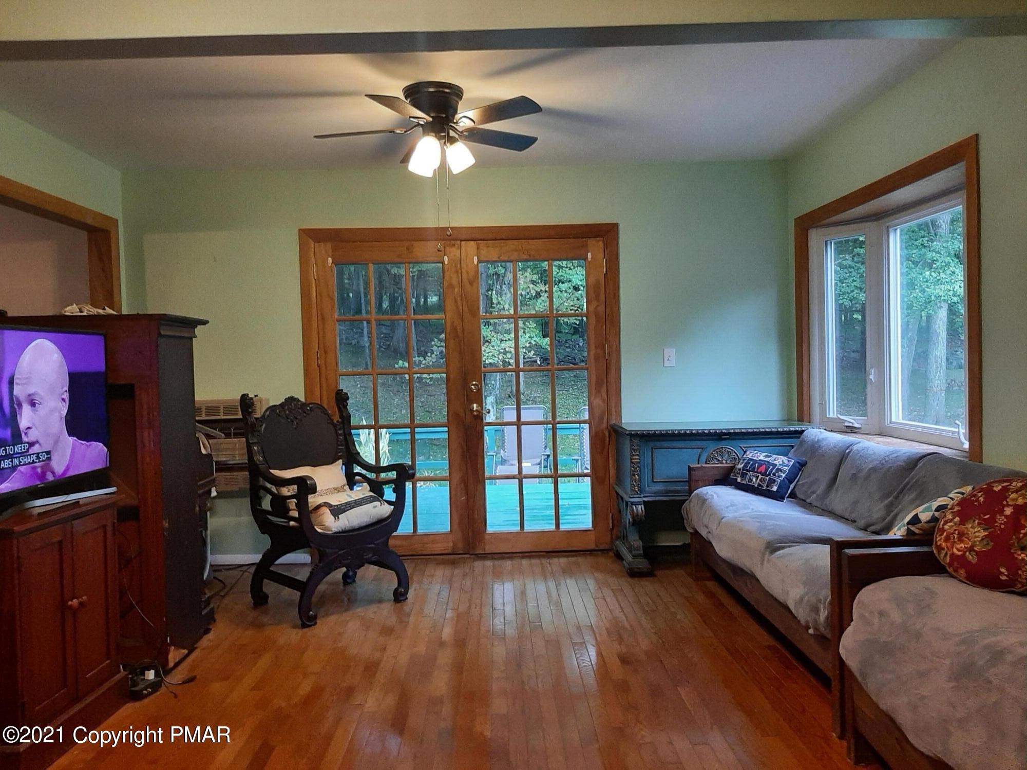235 Dyson Road Swiftwater, PA 18370 - Photo 7 of 36 a living room with furniture and a window