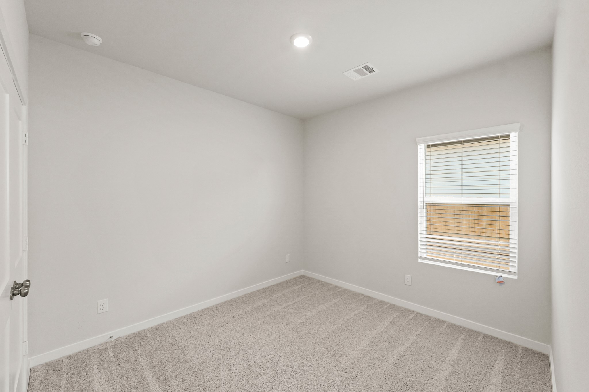 9782 Caney Bend Road Conroe, TX 77303 - Photo 15 of 32 an empty room with a window