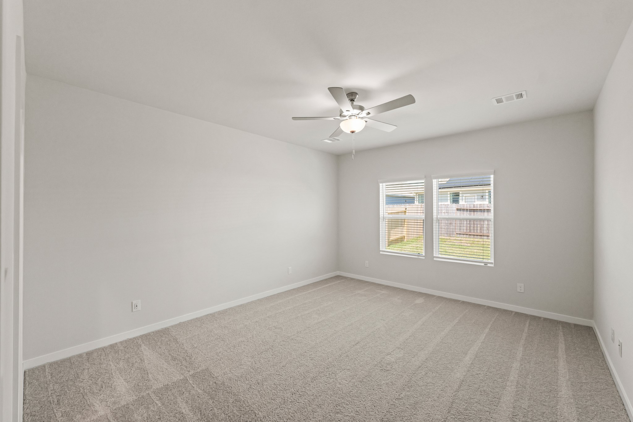 9782 Caney Bend Road Conroe, TX 77303 - Photo 21 of 32 an empty room with a window