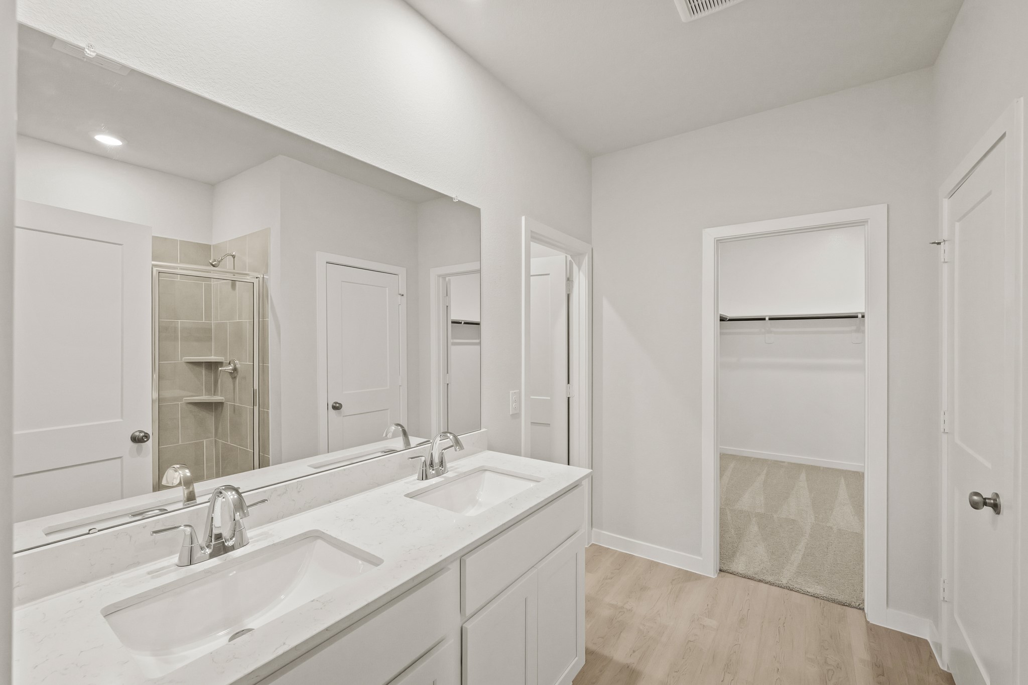 9782 Caney Bend Road Conroe, TX 77303 - Photo 23 of 32 a bathroom with a sink double vanity and a mirror