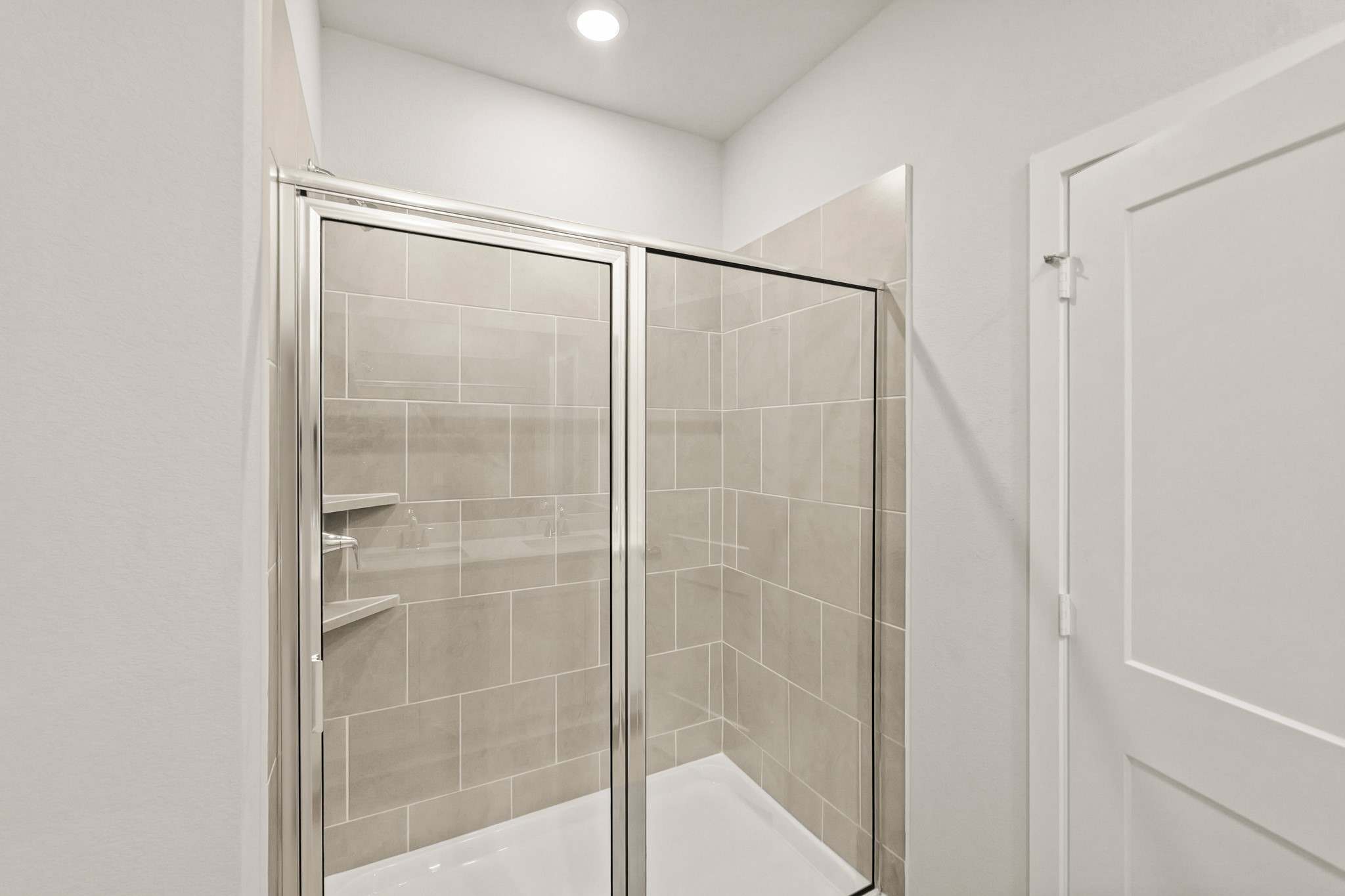 9782 Caney Bend Road Conroe, TX 77303 - Photo 24 of 32 a bathroom with a glass shower door