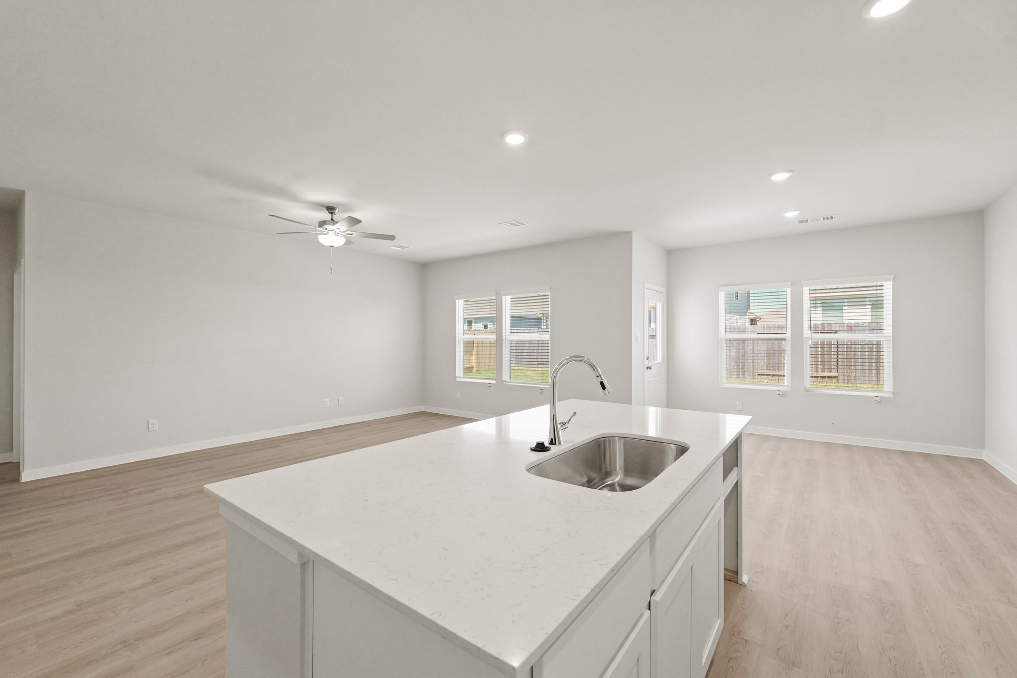 9782 Caney Bend Road Conroe, TX 77303 - Photo 6 of 32 a kitchen with a sink cabinets and wooden floor