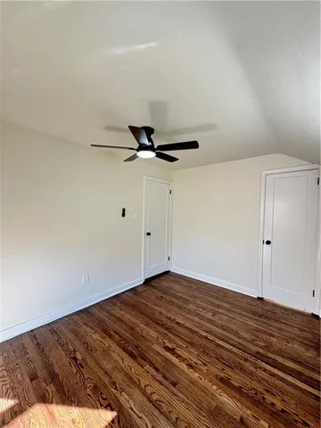 a view of a room with wooden floor