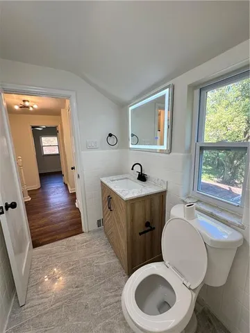a bathroom with a toilet a sink and a bathtub