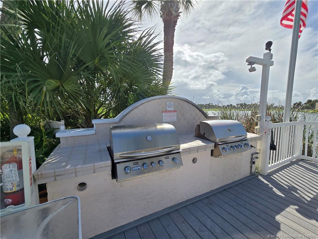 484 Northeast Plantation Road, Unit 4103 Stuart, FL 34996 - Photo 15 of 19 a white bath tub sitting in a bathroom