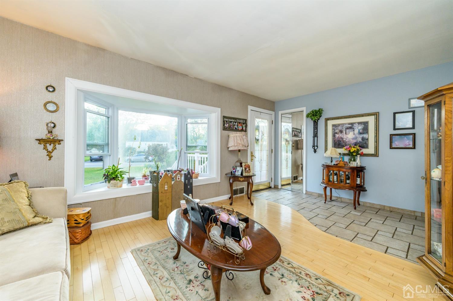 136 Tunison Road New Brunswick, NJ 08901 - Photo 5 of 33 a living room with furniture and wooden floor
