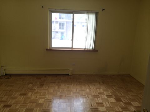 875 Tree Lane, Unit 204 Prospect Heights, IL 60070 - Photo 5 of 6 a view of a small space with wooden floor and a window