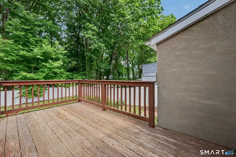 a view of balcony with wooden floor