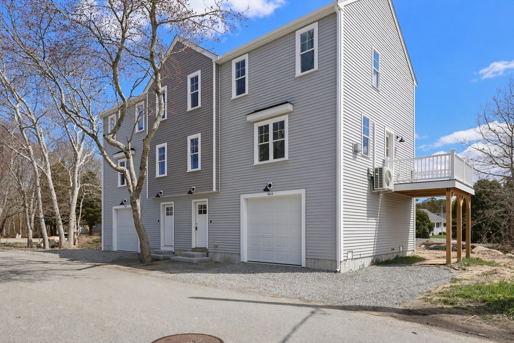 a view of a house with a street