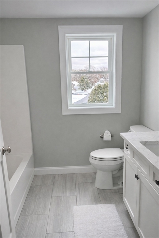 46 Holt Road, Unit A Bourne, MA 02532 - Photo 18 of 28 a bathroom with a toilet sink and window
