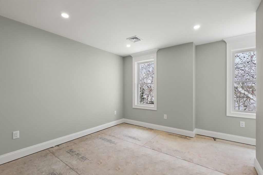 46 Holt Road, Unit A Bourne, MA 02532 - Photo 20 of 28 an empty room with windows