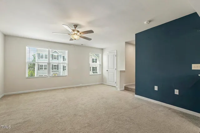 a view of a livingroom with a kitchen