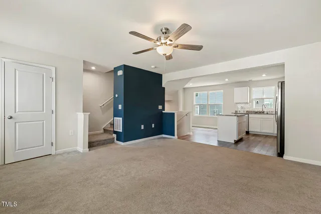a view of a kitchen with a sink and a window