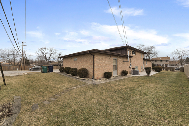10700 Austin Avenue Chicago Ridge, IL 60415 - Photo 18 of 19 a view of a house with a yard