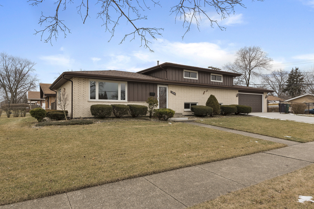 10700 Austin Avenue Chicago Ridge, IL 60415 - Photo 19 of 19 a front view of a house with a yard