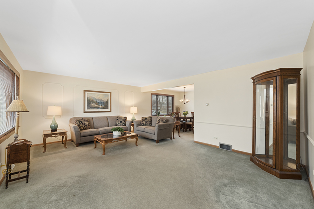 10700 Austin Avenue Chicago Ridge, IL 60415 - Photo 3 of 19 a living room with furniture and a window