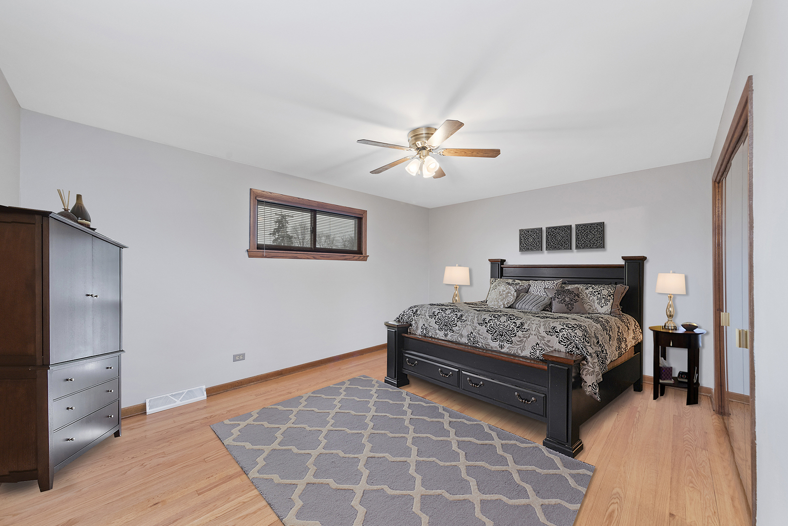 10700 Austin Avenue Chicago Ridge, IL 60415 - Photo 9 of 19 a bedroom with a bed and a chandelier