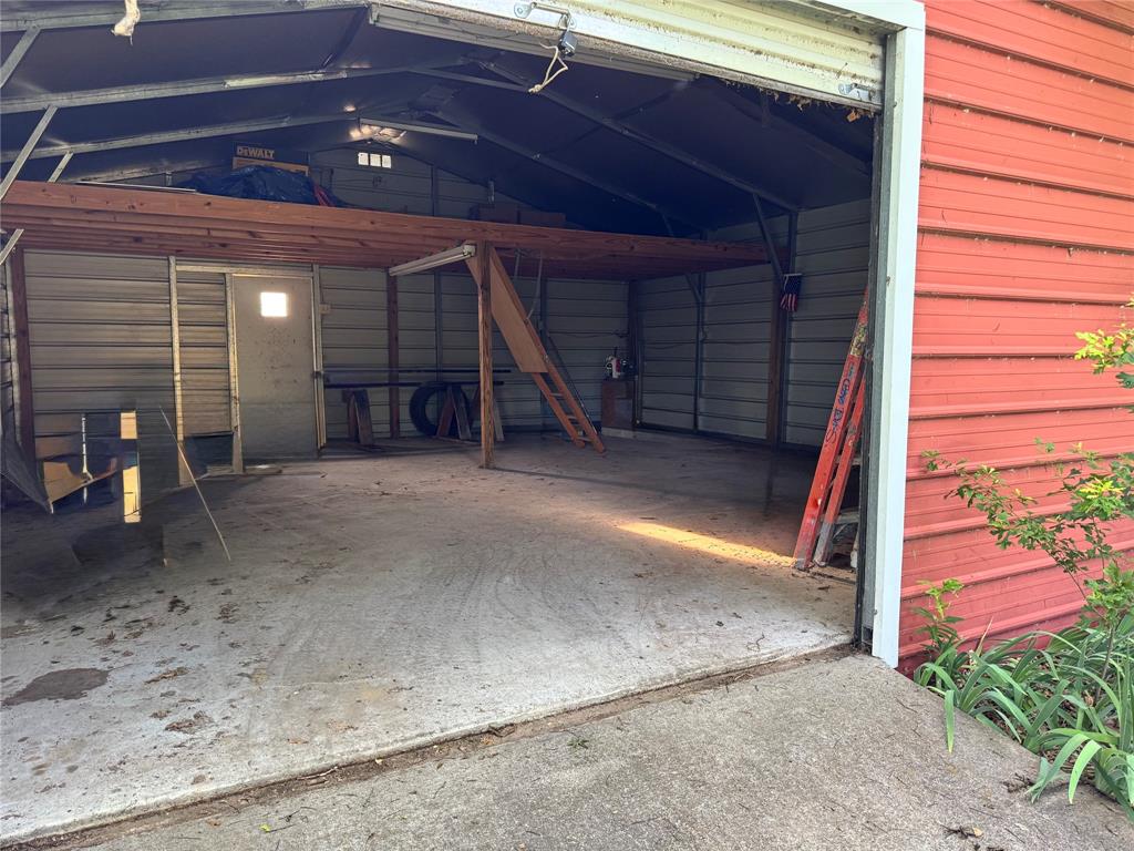 10065 Comanche Road Quinlan, TX 75474 - Photo 26 of 36 a view of a big room with staircase