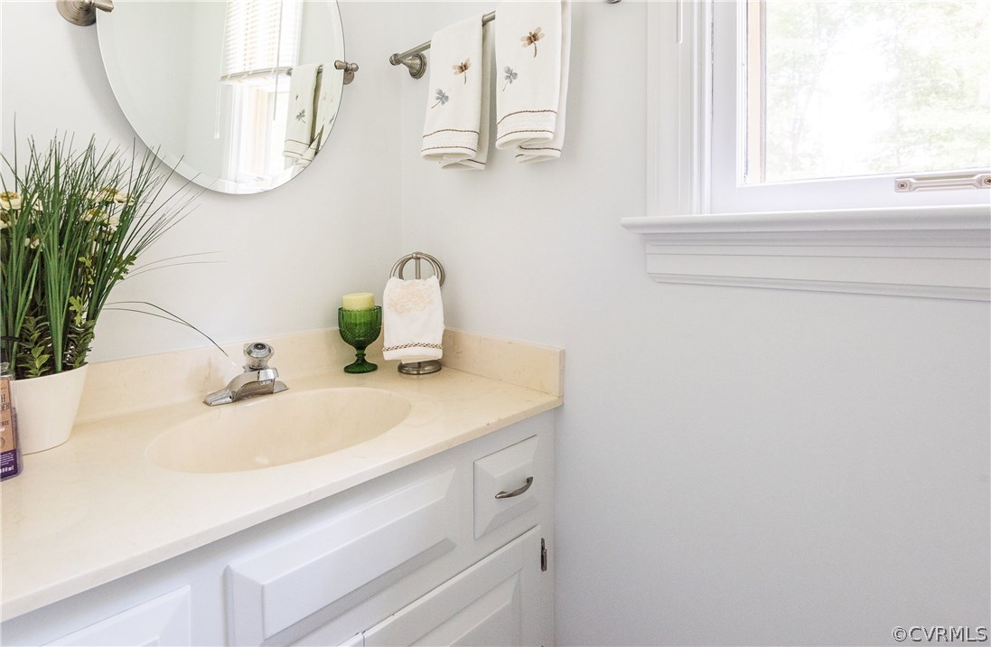 14008 Walnut Creek Road Midlothian, VA 23112 - Photo 21 of 34 a bathroom with a sink and a mirror