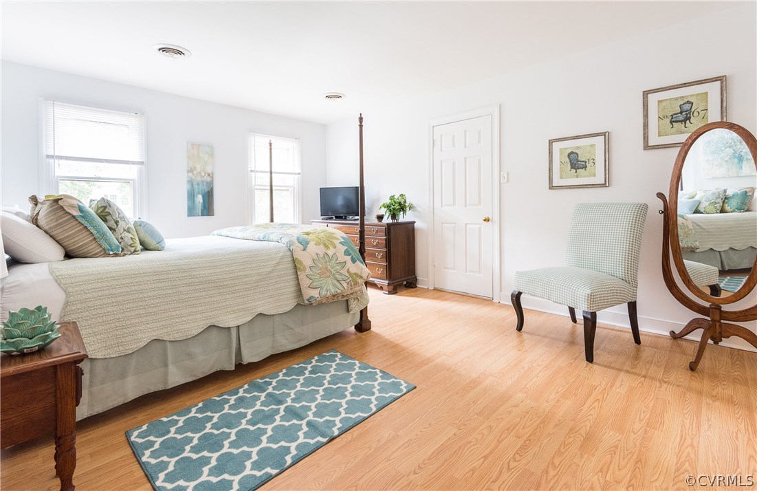 14008 Walnut Creek Road Midlothian, VA 23112 - Photo 23 of 34 a bedroom with a bed a chair and a potted plant