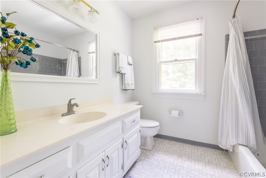 14008 Walnut Creek Road Midlothian, VA 23112 - Photo 26 of 34 a bathroom with a sink a toilet and a mirror