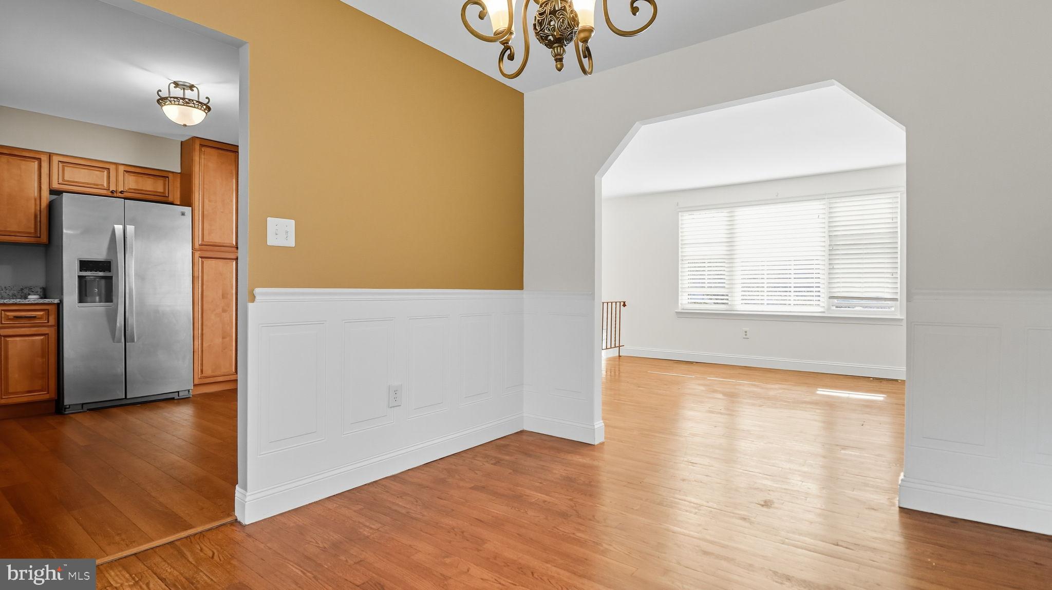 8136 Comet Drive Fort Washington, MD 20744 - Photo 11 of 49 a view of empty room with wooden floor and fan