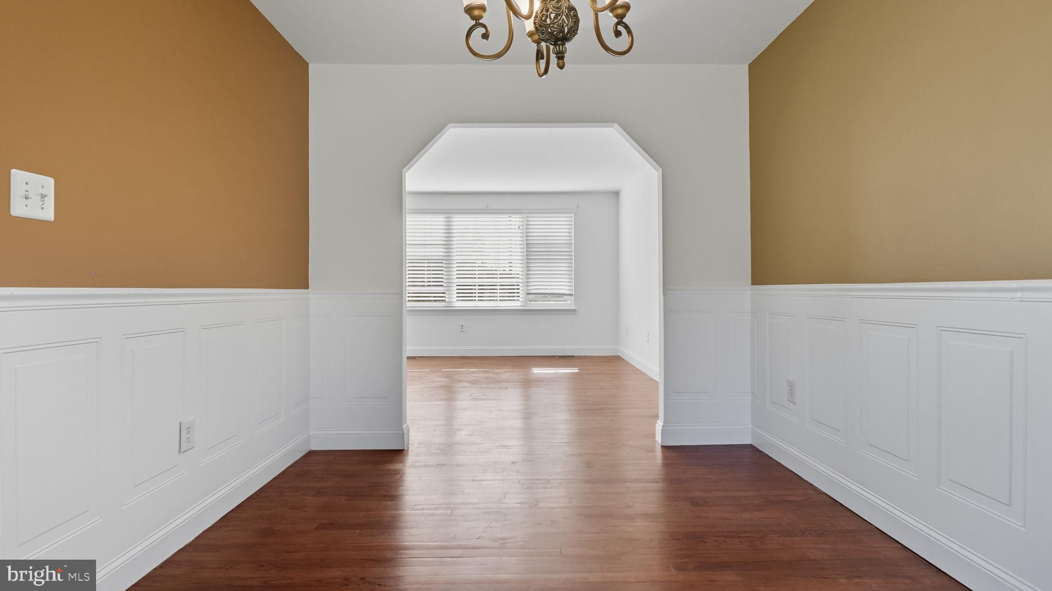 8136 Comet Drive Fort Washington, MD 20744 - Photo 12 of 49 a view of an empty room with wooden floor and a window