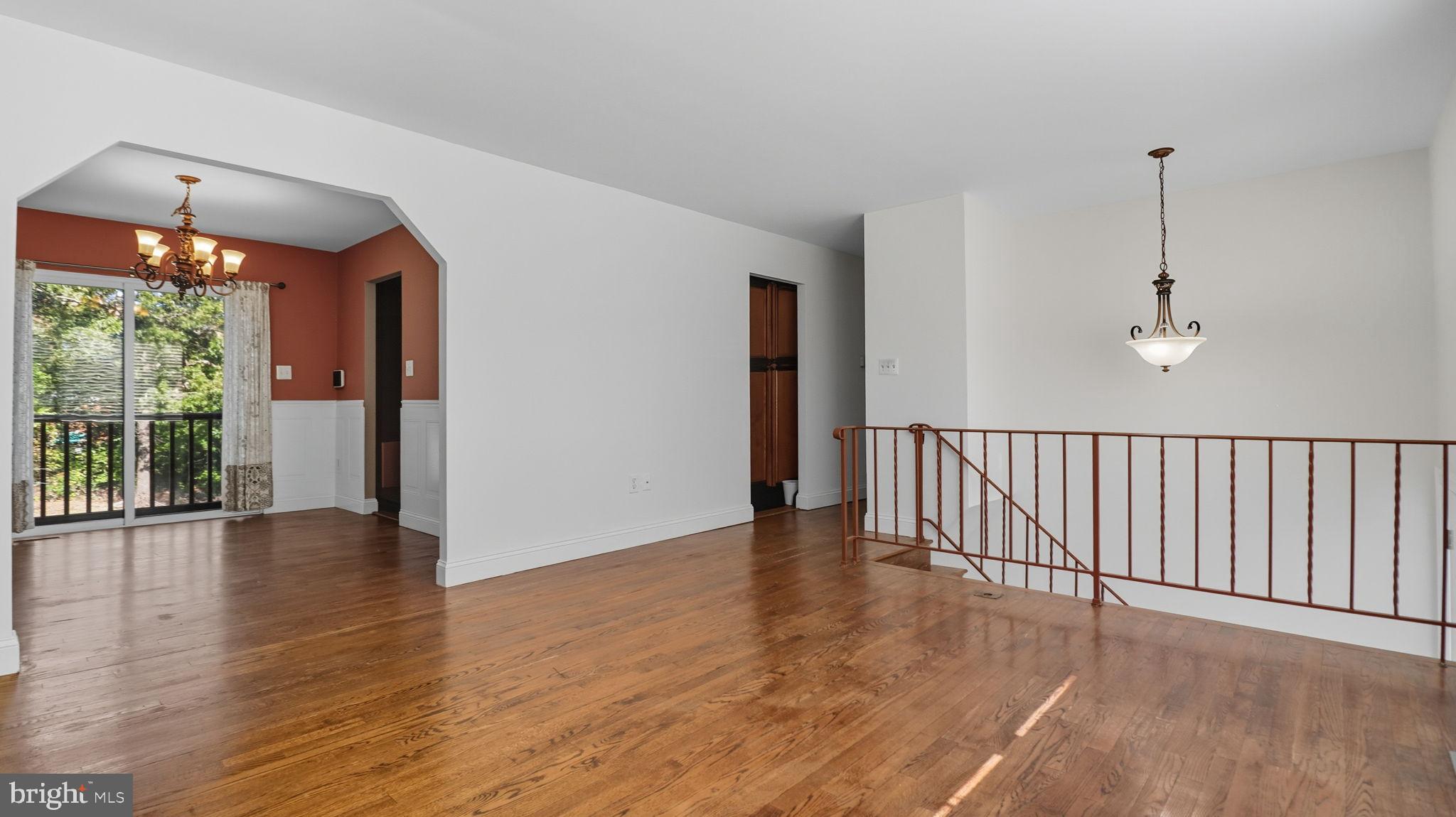 8136 Comet Drive Fort Washington, MD 20744 - Photo 17 of 49 a view of an empty room with wooden floor and a window