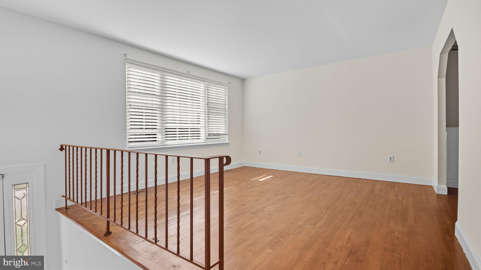 8136 Comet Drive Fort Washington, MD 20744 - Photo 20 of 49 a view of an empty room with wooden floor and a window