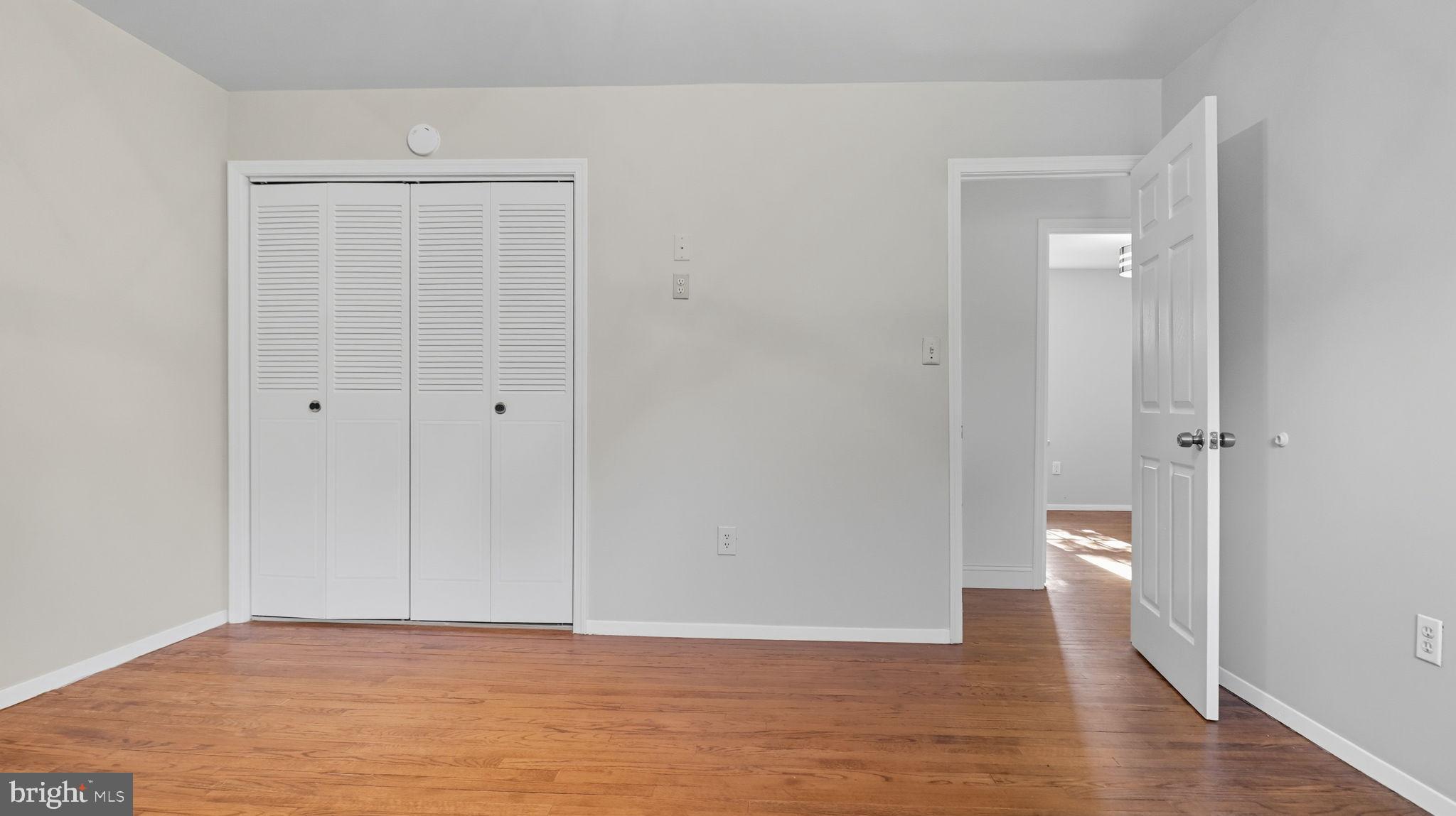 8136 Comet Drive Fort Washington, MD 20744 - Photo 25 of 49 a view of an empty room with wooden floor