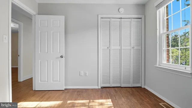 a view of front door with wooden floor