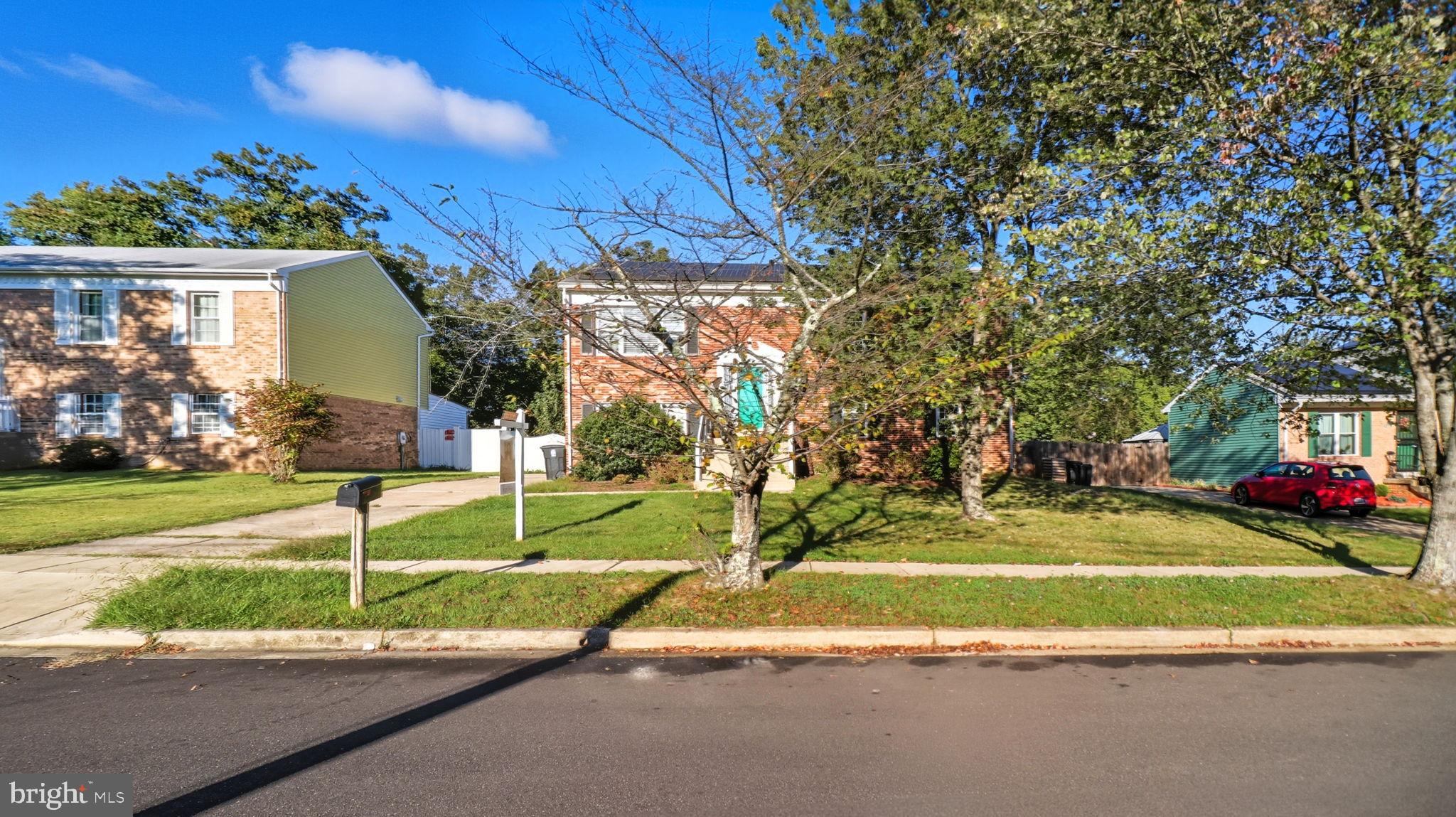 8136 Comet Drive Fort Washington, MD 20744 - Photo 3 of 49 a view of a house with a yard and a garden