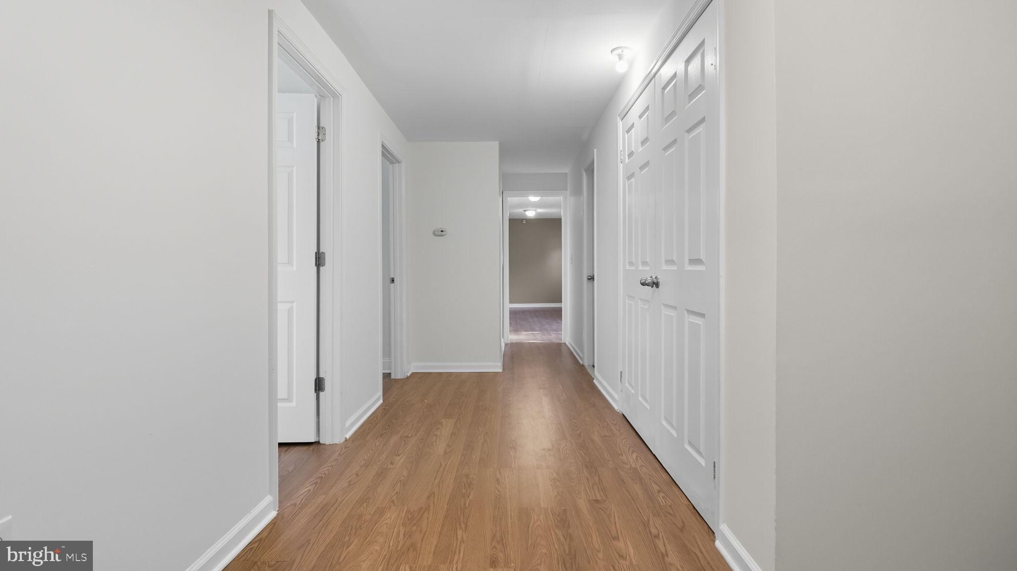 8136 Comet Drive Fort Washington, MD 20744 - Photo 31 of 49 a view of a hallway with wooden floor