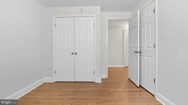 an empty room with wooden floor