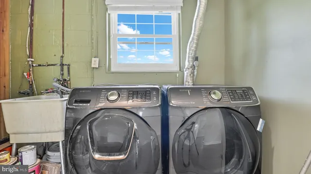 a utility room with dryer and washer