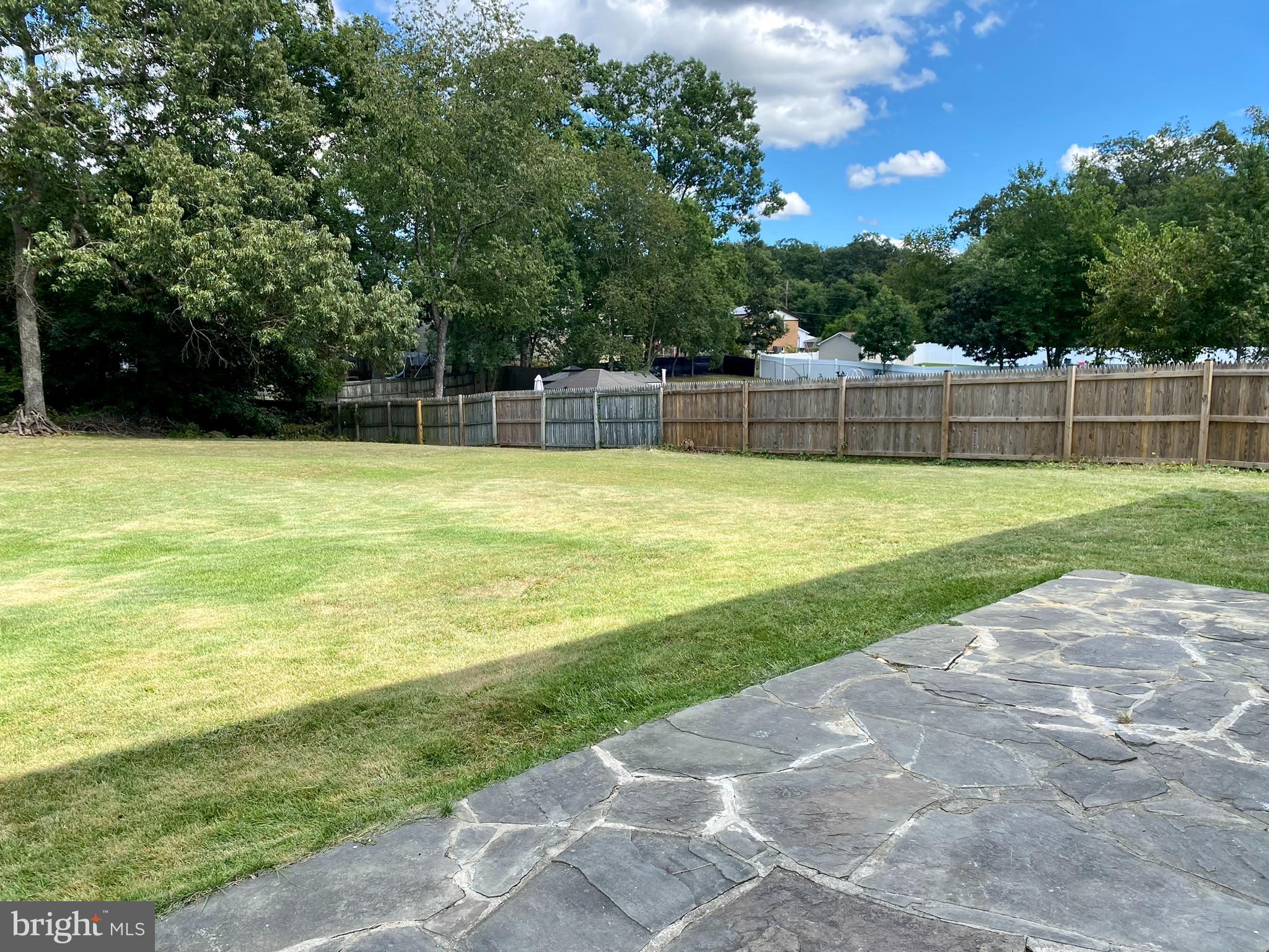 8136 Comet Drive Fort Washington, MD 20744 - Photo 46 of 49 a view of a swimming pool with a yard