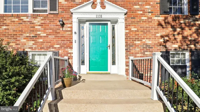 a view of a balcony with two windows