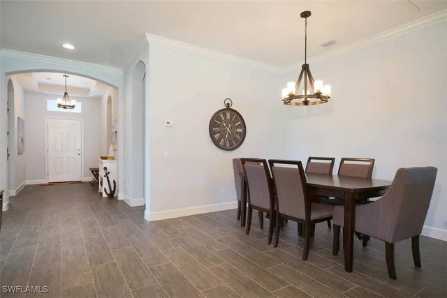 a view of a room with furniture and wooden floor