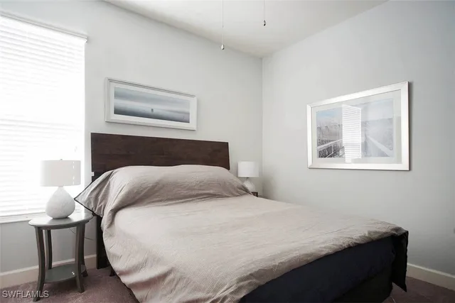 a bedroom with a bed and chair