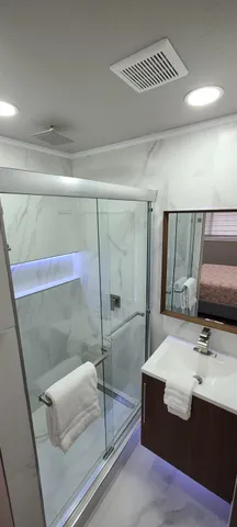 a bathroom with a sink and a mirror