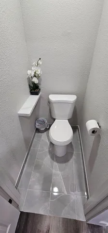 a bathroom with a toilet and a sink