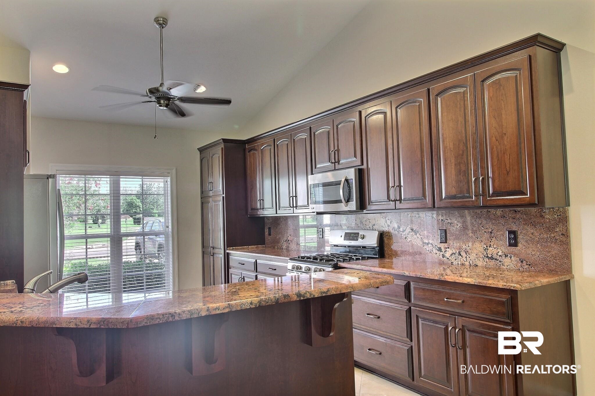 32891 Arbor Ridge Circle Lillian, AL 36549 - Photo 2 of 37 Custom cabinets with granite counter, back splash