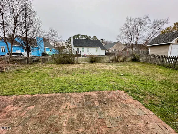 a house that has a big yard in front of it