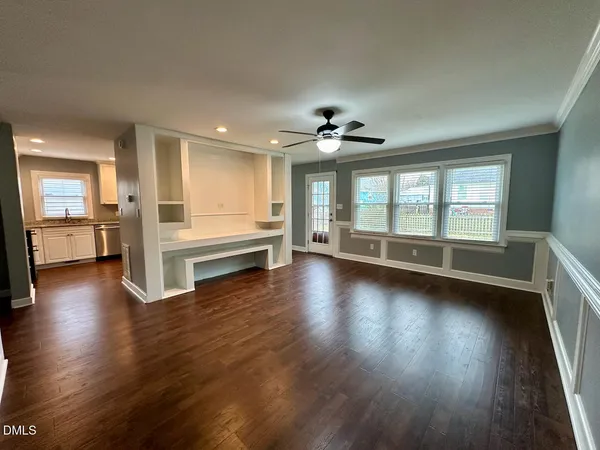 a kitchen with stainless steel appliances granite countertop a refrigerator stove and sink
