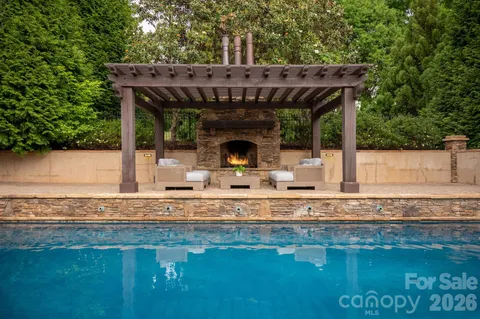 a view of a backyard with sitting area